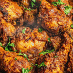 Chicken moambe recipe served in rustic bowl with steam rising