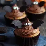 Halloween bat muffin with chocolate frosting and bat decorations