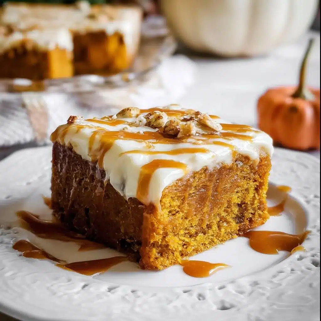 Delicious Pumpkin Caramel Poke Cake topped with caramel drizzle and whipped cream.