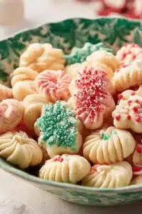 Old Fashioned Spritz Cookies on a festive plate ready for the holidays.