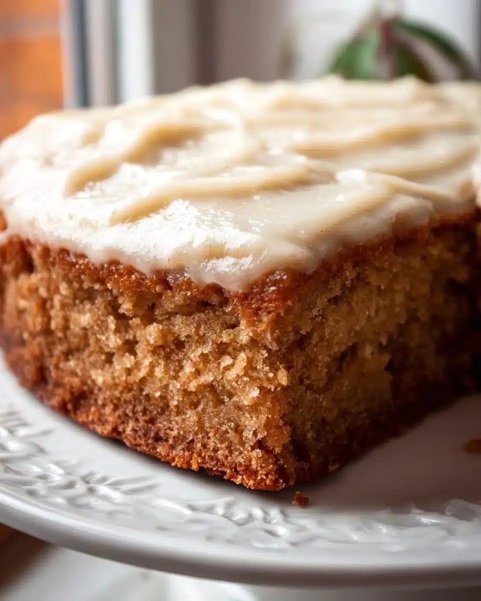 Delicious slice of healthy applesauce cake topped with frosting